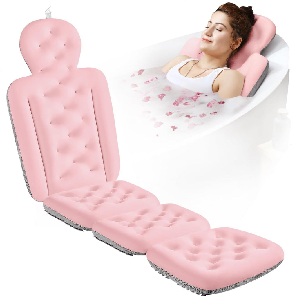Pink inflatable bathtub seat with a woman relaxing in a bathtub filled with water and flowers.