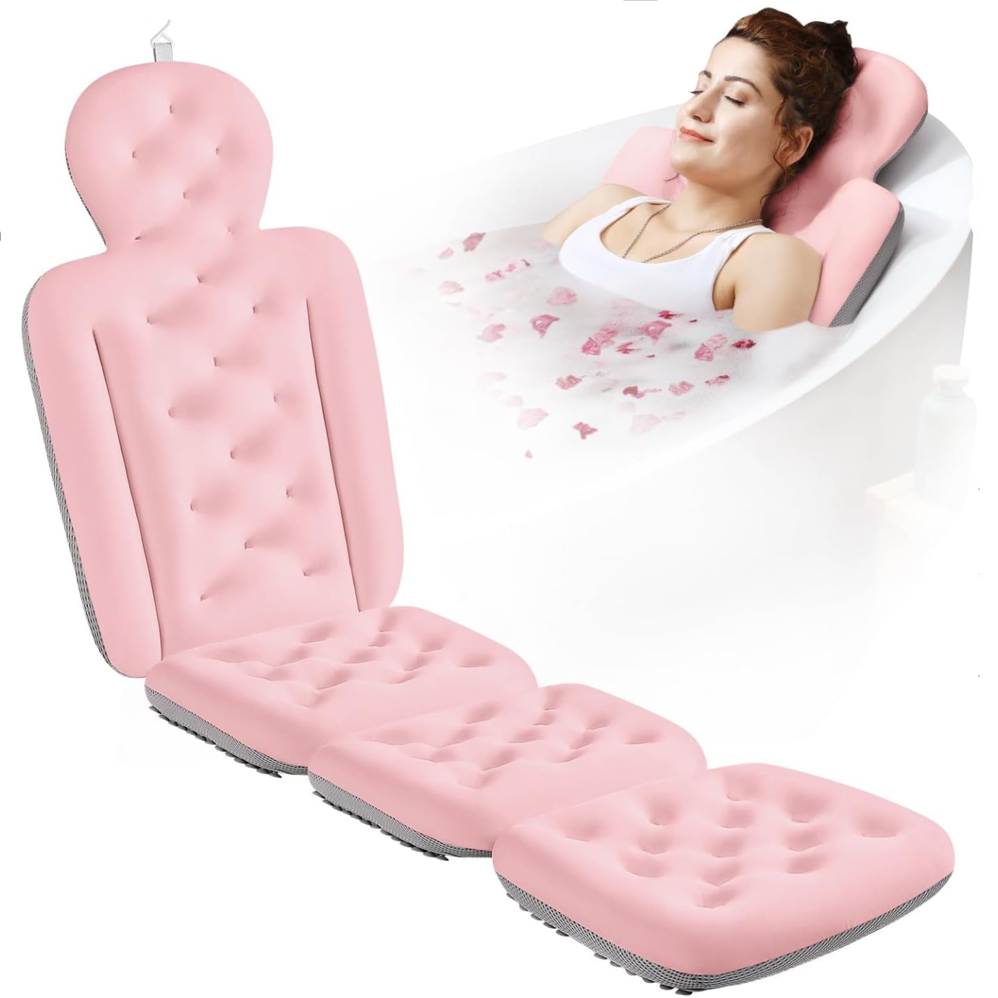 Pink inflatable bathtub seat with a woman relaxing in a bathtub filled with water and flowers.