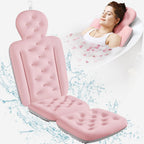 Pink inflatable bathtub seat with a woman relaxing on it, surrounded by water droplets.